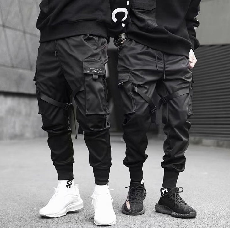🔥 Urban Recon Tactical Joggers

These joggers have that edgy, street-meets-utility look — clean black, adjustable straps, cargo-style pockets — very urban drip and functional.